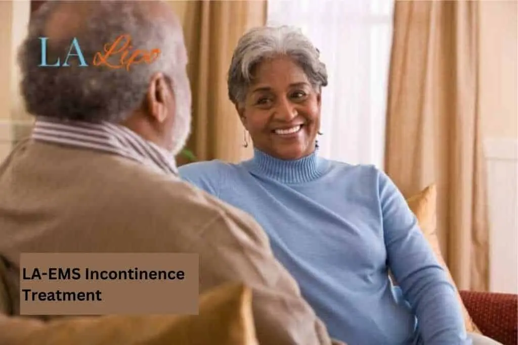 Couple sat smiling at each other - LA-EMS treatment Cheltenham